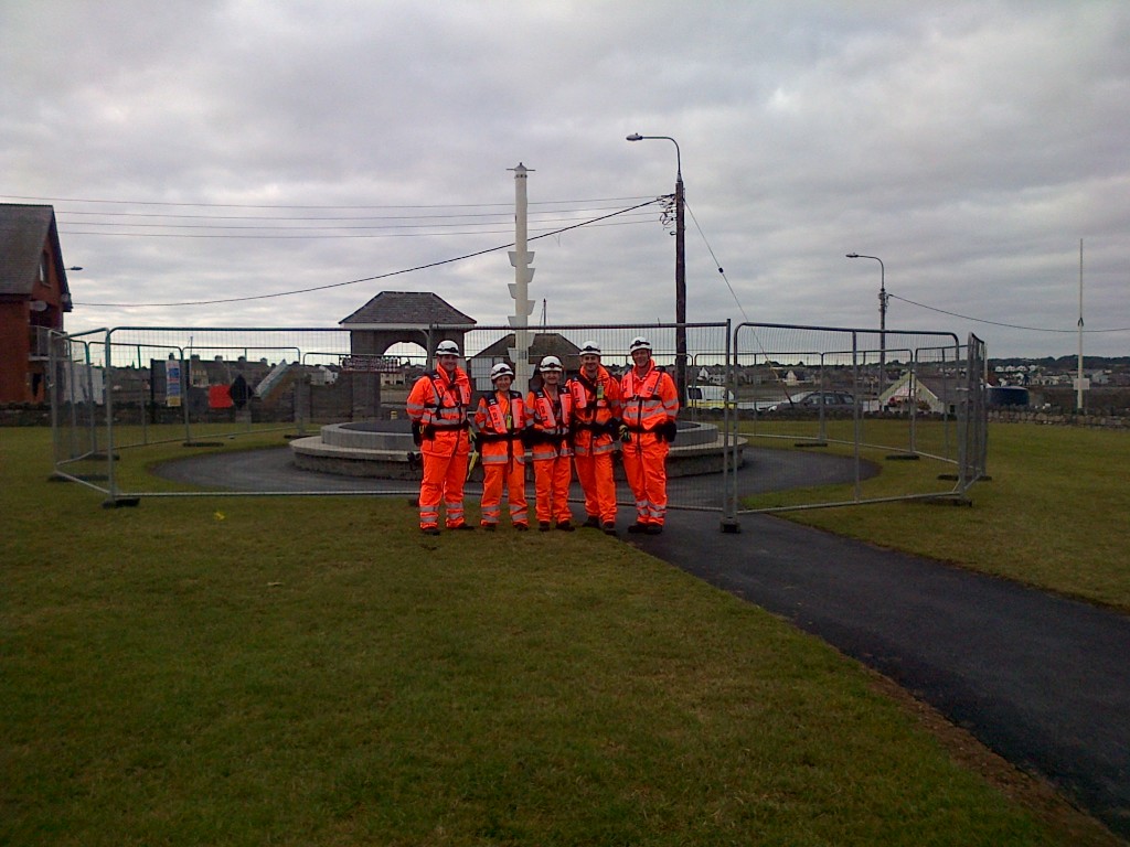 Members of Skerries Coast Guard with the SeaPole under construction at Red Island, Skerries.