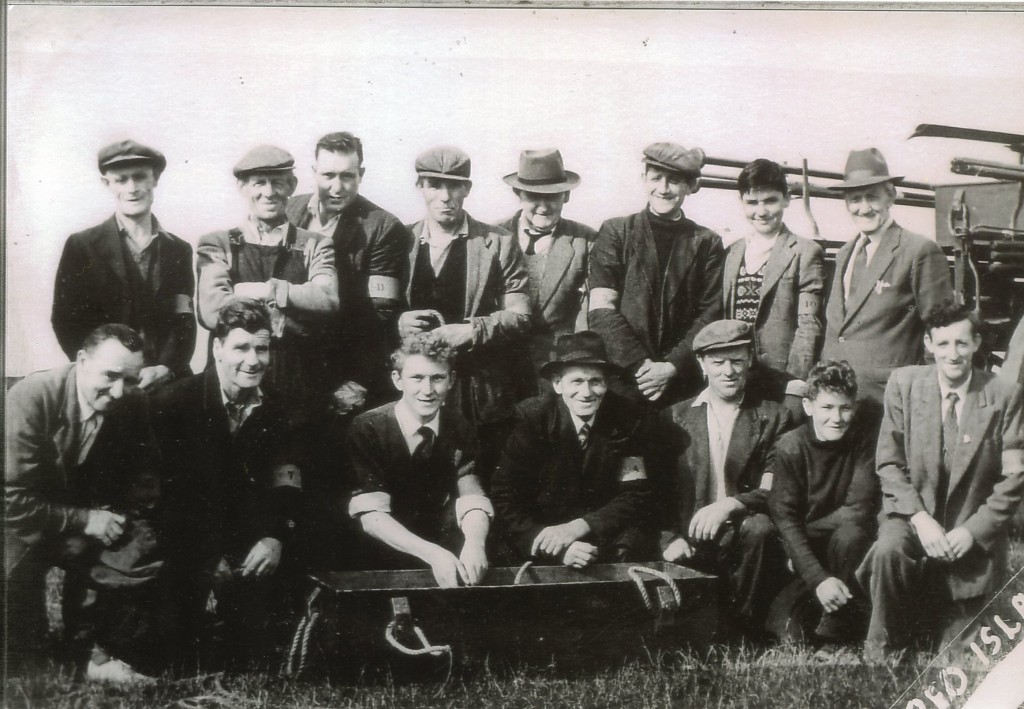 Black and white group photo of the Skerries Coast Guard crew at a training exercise at Red Island in 1958